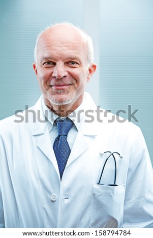 Self confident smiling doctor in white coat