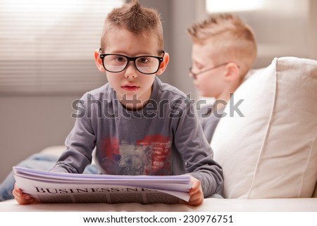 little business baby reading shocking news ready to face the shock