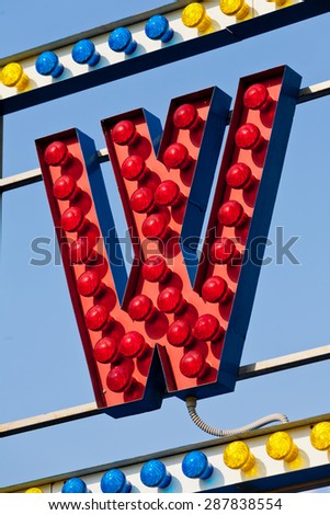 classic electric sign like the ones used in circus or old fashioned shops representing the W letter