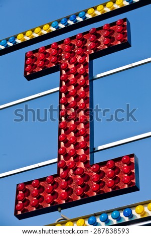 classic electric sign like the ones used in circus or old fashioned shops representing the I letter