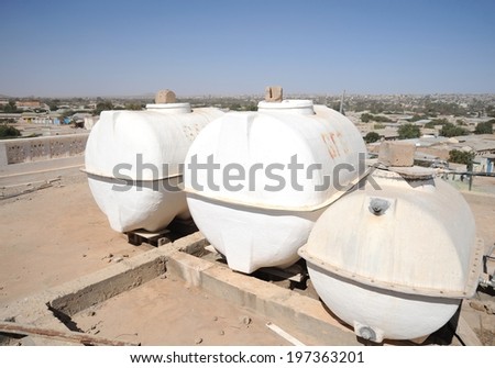 HARGEISA, SOMALIA - JANUARY 8, 2010: Water heaters on a  roof  Edna Adan University Hospital. The scorching sun Africa allows to heat water a natural way.