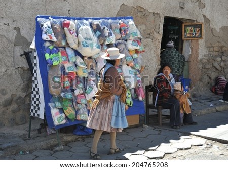 POTOSI, BOLIVIA - SEPTEMBER 8, 2010: Potosi  is one of the highest cities in  world. History City is closely connected with extraction of rich deposits of silver. Local inhabitants on the city streets