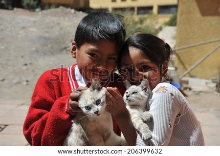 POTOSI, BOLIVIA - SEPTEMBER 7,2010: Potosi is one of highest cities in world. History City is closely connected with extraction of rich deposits of silver.Unidentified children on street of Potosi