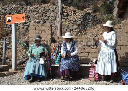 ISLAND OF THE MOON, BOLIVIA - SEPTEMBER 4, 2010 : Island of the Moon is located on lake Titicaca. At the time of the Incas lived here in seclusion young women. Unknown womans on the island of the Moon