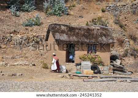 ISLAND OF THE MOON, BOLIVIA - SEPTEMBER 4, 2010 : Island of the Moon is located on lake Titicaca. Incas live here in seclusion. Unknown woman on the island of the Moon.