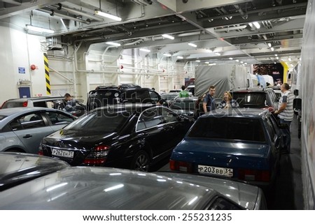 PORT CRIMEA, KERCH, RUSSIA - SEPTEMBER 15, 2014: Unloading vehicles on the ferry in the port of Crimea. Train ferry between port Crimea, Kerch, and port Caucasus.