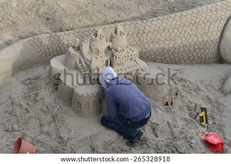 ORIHUELA COSTA, SPAIN - APRIL 1, 2014:Sand sculpture in Orihuela Costa.Orihuela Costa is recognized as the most ecological clean region of Europe, famous for its clean beaches  of the Costa Blanca.