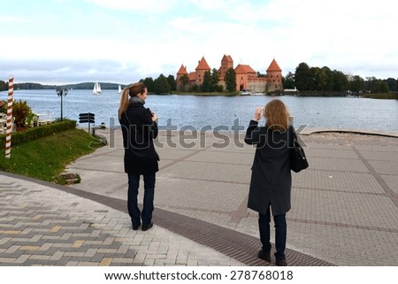 TRAKAI, LITHUANIA - SEPTEMBER 29, 2013:Tourists in the castle of Trakai.Medieval castle in Trakai, the first capital city of Lithuania. Is one of the most popular tourist attraction.
