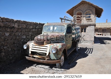 UYUNI, BOLIVIA - SEPTEMBER 9, 2010: Old car in the village of solidarities on lake Uyuni. Dried up salt lake in Altiplano. The largest salt flat in the world.