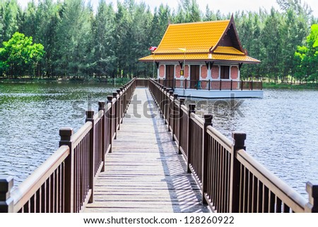 A long bridge is leading to a pavilion on the lake, Phuket