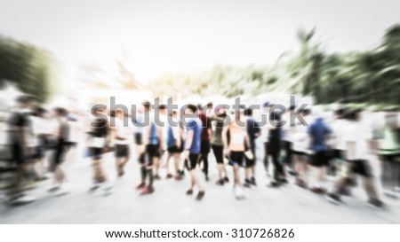 Motion Blurred crowd of athlete for marathon under sunlight