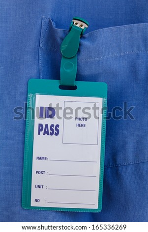 Blank name leather badge on blue shirt background