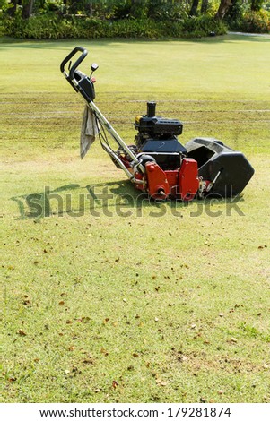 Lawnmower mowing machine park in the garden