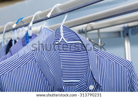 Close-up of blue shirt wait for dry during daytime
