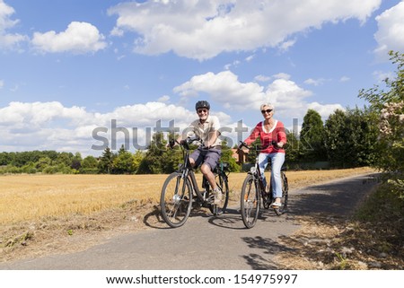 senior couple enjoying bike trip