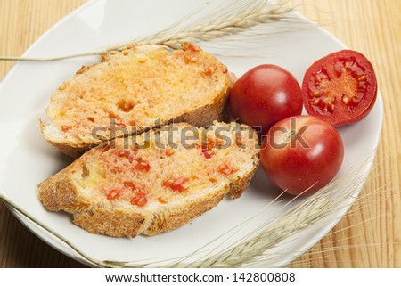 Bread sliced  with tomato rubbed over and olive oil/ Bread sliced  with tomato rubbed over and olive oil
