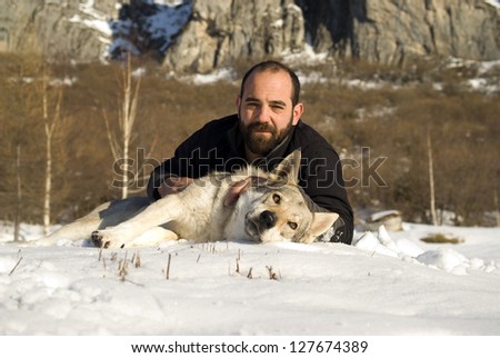 Man and his Czechoslovakian wolf dog
