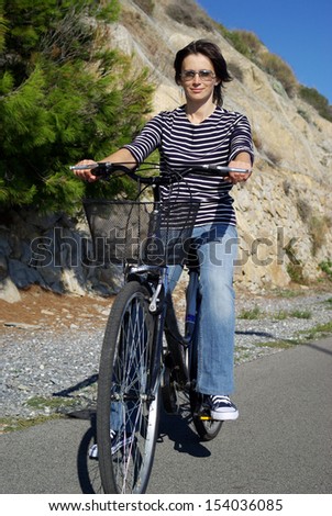 Beautiful woman on bike outdoors