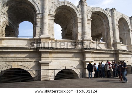 ARLES, FRANCE - OCTOBER 27: Tourists visiting the Arles Amphitheatre, a Roman arena in the southern French on October 27, 2013.