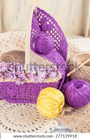 Yarn for crochet and knitted openwork napkins, still life photo with tools for handmade.