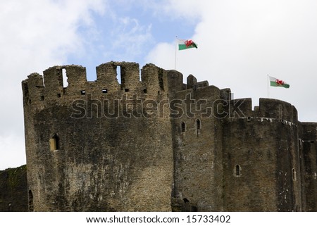 Caerphilly castle towers with Welsh flags, South Wales, UK