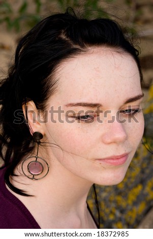 Girl with freckles and  black hair - portrait