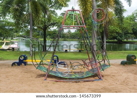 Old boat swing on a playground