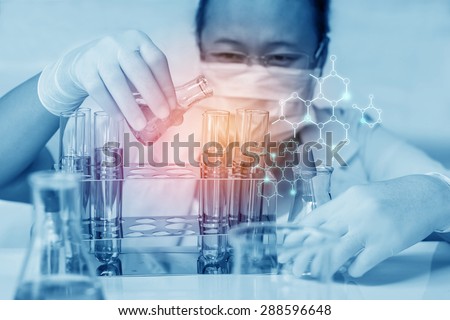 Medical or scientific researcher with flask making test or research in clinical laboratory.
