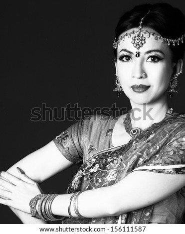 Beautiful brunette portrait with traditional costume shot black and whit