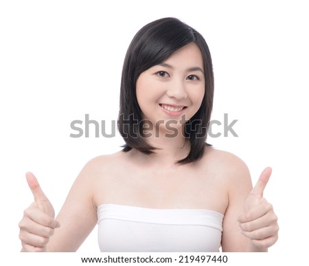 Happy excited young woman gives a thumbs up gesture