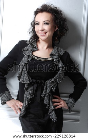 Elegant woman in black cocktail dress