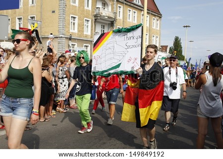 SZCZECIN, POLAND - AUGUST 4th: Crew Parade during the Final of The Tall Ships Races 2013 in Szczecin, the crews of the tall ships with street artists paraded through the streets of Szczecin, Poland.