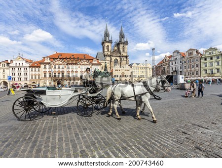 PRAGUE, CZECH REPUBLIC - JUNE 13, 2014:  Horse Carriage waiting for tourists at the Old Square in Prague.
