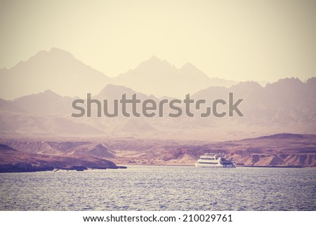 Vintage picture of a boat on the sea in Egypt.