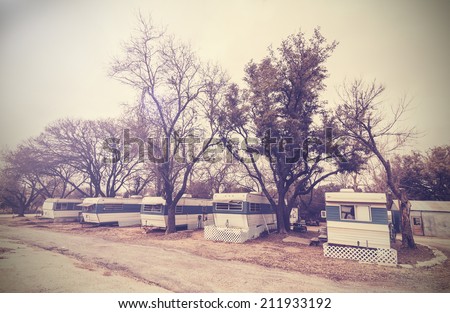 Vintage picture of american house trailers estate, USA countryside.