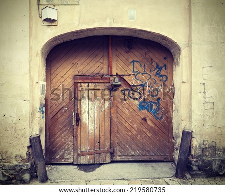 Vintage picture of old brown wooden front door.