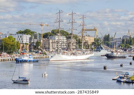 SZCZECIN, POLAND - JUNE 15, 2015: End of Tall Ships Regatta 2015 Final in Szczecin. Dar Mlodziezy, one of the biggest ships is about to leave the harbor.