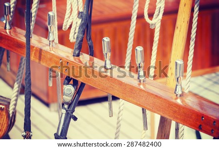 Retro style wooden sailing ship equipment, nautical background.