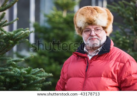 Senior Man shopping for a Christmas Tree
