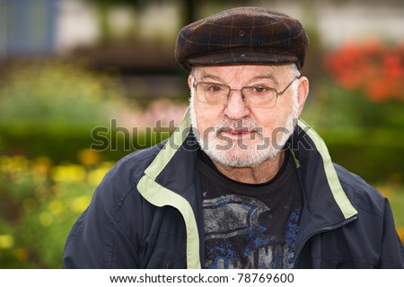 Portrait of senior man wearing flat cap