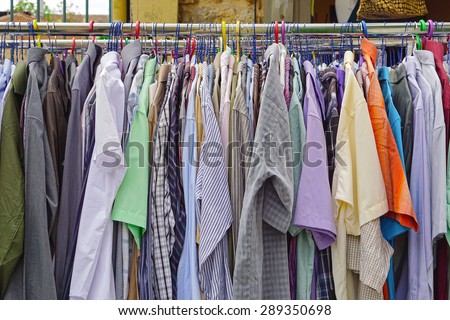 Used shirts hanging at clothes rails