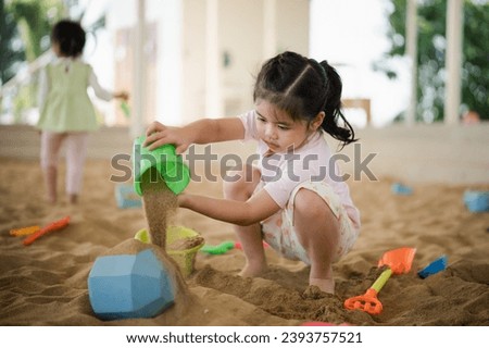 Similar – Image, Stock Photo Joyful couple on playground against grassy field