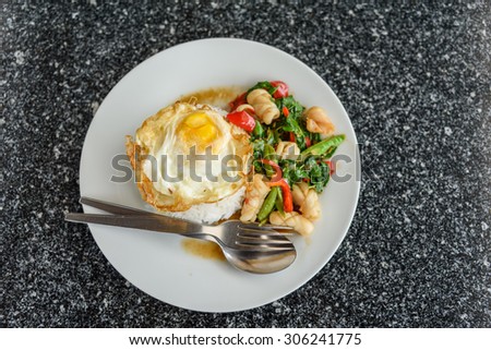Thailand food dish is Fried rice with squid and fried egg