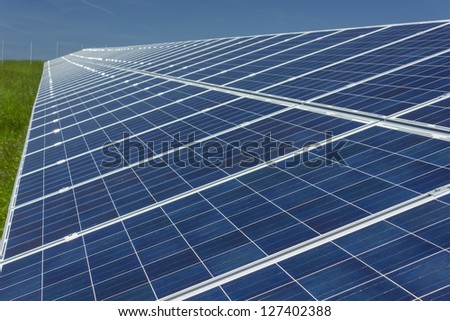 Electric photovoltaic solar panels cells on a field.