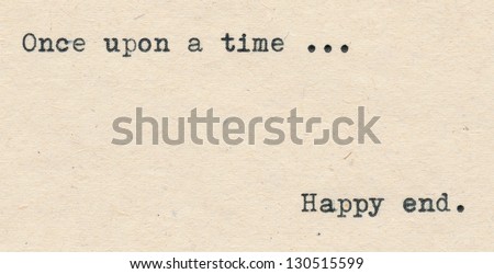 Once upon a time and Happy end written with a typewriter on an aged paper.