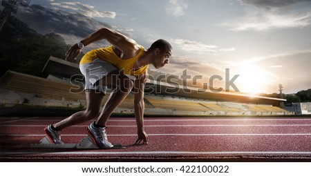 Sport. Sprinter leaving starting blocks on the running track.  Foto d'archivio © 