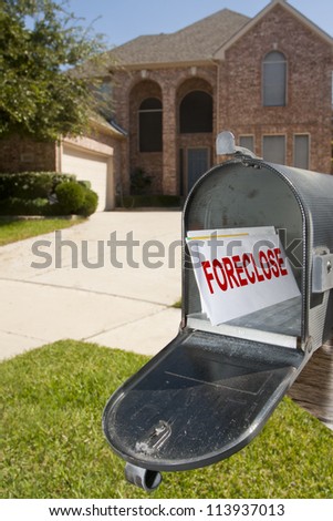Mailbox filled with monthly bills and notices