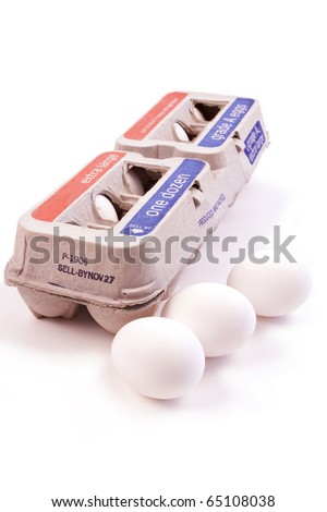 One dozen eggs in a carton isolated on white background with three eggs