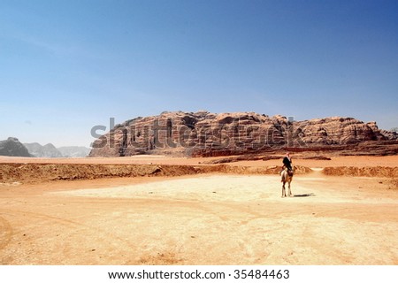Wadi Rum is a valley cut into the sandstone and granite rock in southwest Jordan. It is the largest wadi in Jordan. The name Rum most likely comes from an Aramaic root meaning \'high\' or \'elevated\'.