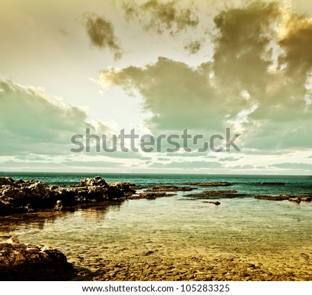 Grunge sea landscape, beautiful peaceful seaview, calm ocean water, summer beach, nature background, old postcard with cloudy sunset